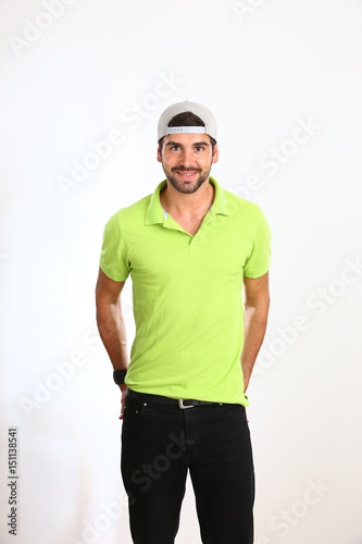 Young man is posing in a Studio