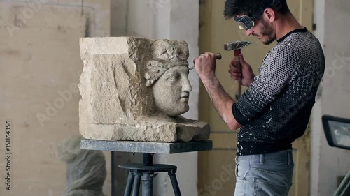 Sculptor is working on the creation of a monument
