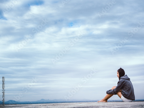 woman sitting on the roof