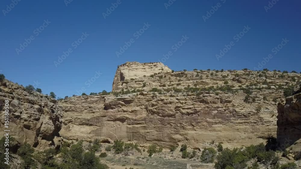 Aerial San Rafael Swell Utah dramatic cliff desert landscape. Desert landscape. Sandstone towers, valleys, canyons, gorges, mesas. Off road all terrain 4x4 vehicle ATV. Thrilling dangerous wilderness.