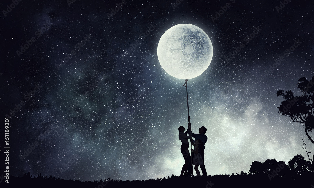 Silhouette of family on night background