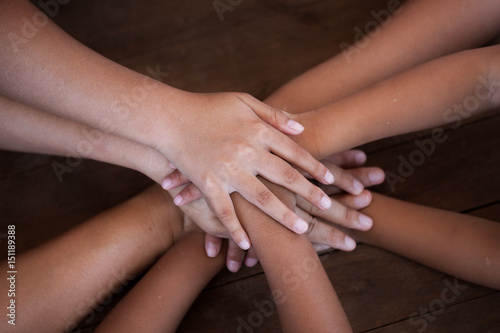 Family and children holding hands together