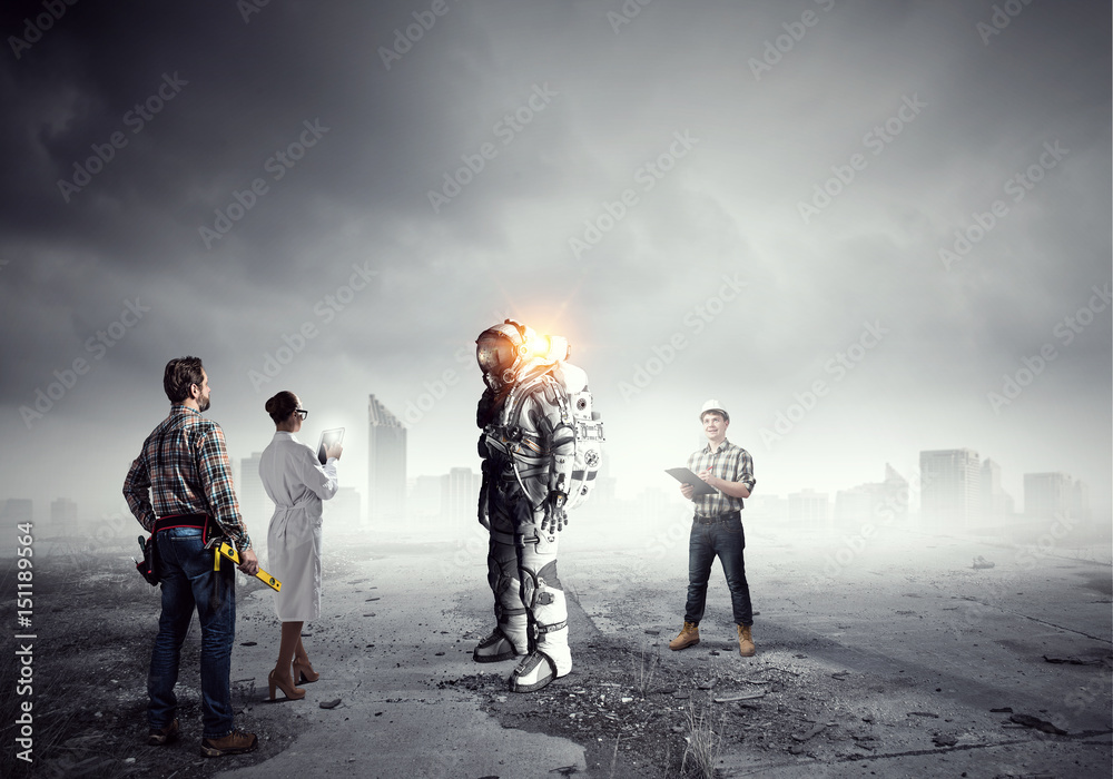 Scientists designing space suit. Mixed media Scientists designing space suit. Mixed media