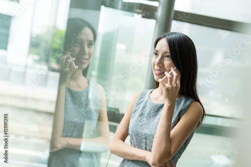 Businesswoman talk to mobile phone in office