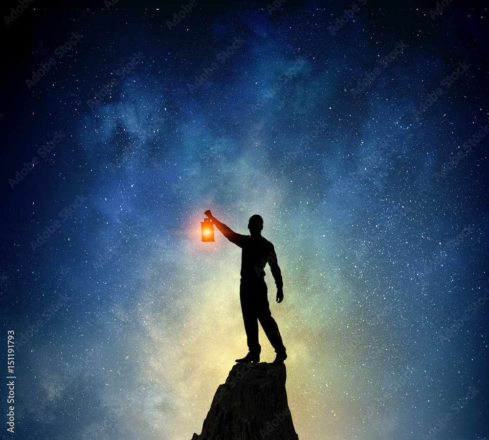 Businessman against starry sky . Mixed media Businessman against starry sky . Mixed media