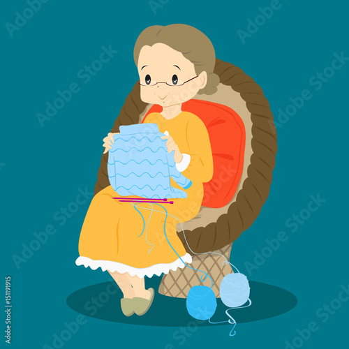 granny take a look at her finished sweater while sitting on a rattan chair 