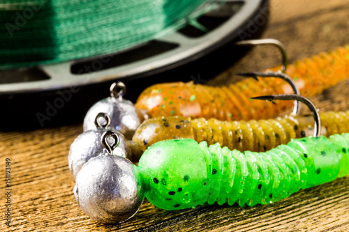 Canvas Print jig fishing lures on a brown wooden table