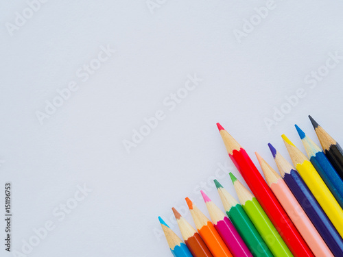 Color pencils on white paper. Education material back to school, for background and wallpaper.