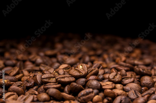 Coffee beans. Dark background with copy space, close-up