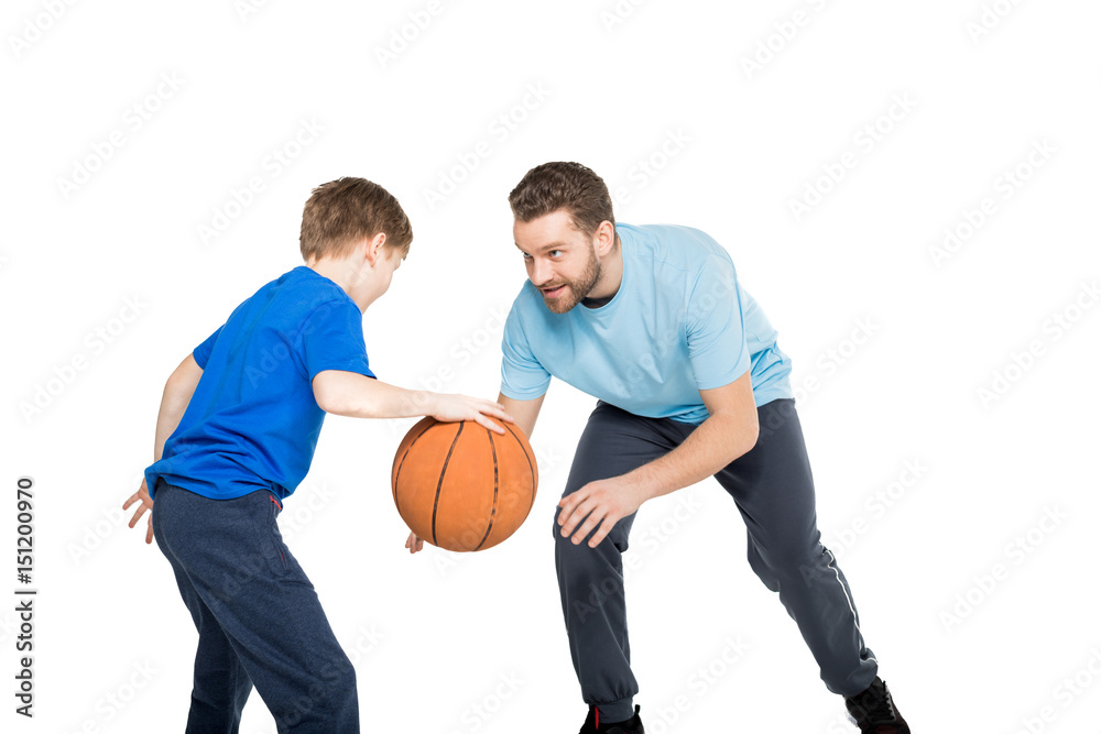 Portrait of father with son playing basketball isolated on white