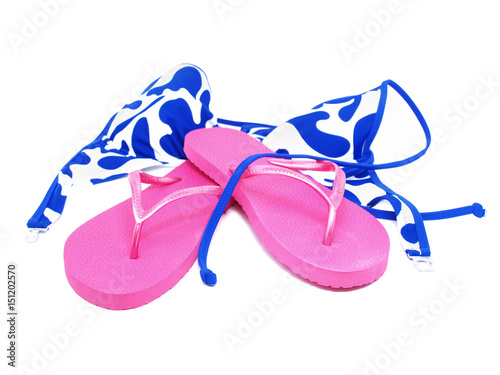 Female swimsuit and beach sneakers on a white background