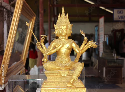 Statue of golden bhudda in public temple. photo