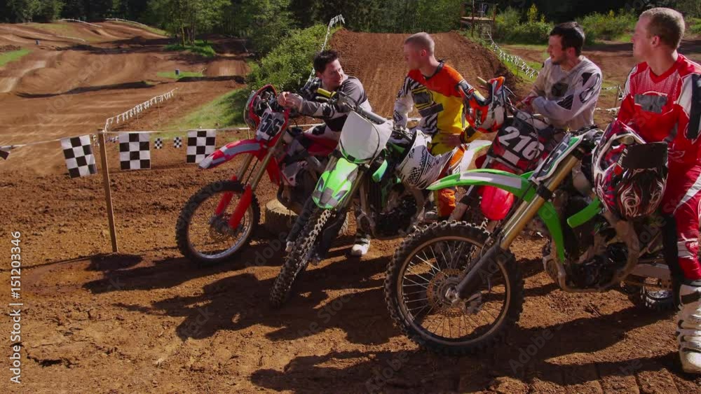 Group of Motocross racers hanging out Group of Motocross racers hanging out