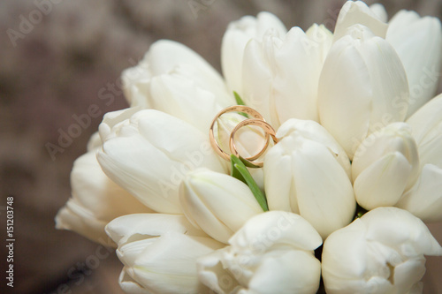 Wedding rings on bride's bouquet