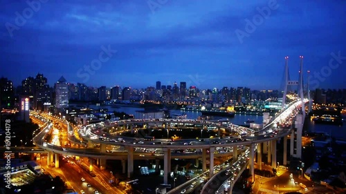 Wallpaper Mural Aerial freeway busy city rush hour heavy traffic jam highway Shanghai at night,nanpu overpass interchange,urban skyline,busy shipping sailing on huangpu river,time lapse. Torontodigital.ca