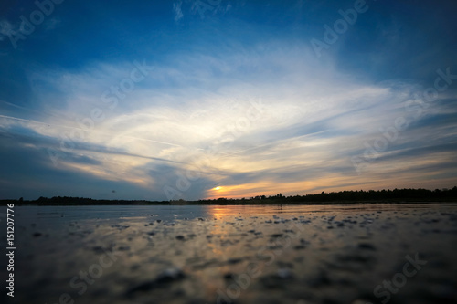 Beautiful sunset on the lake shore © kichigin19