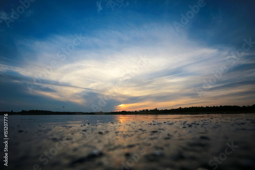 Beautiful sunset on the lake shore