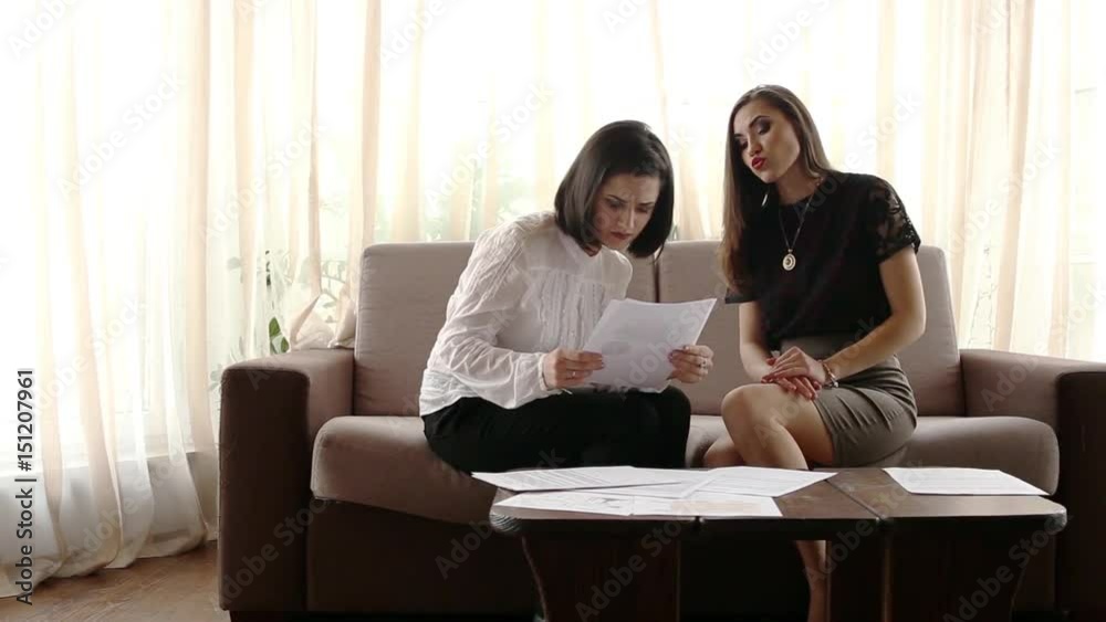 Director discusses with manager performance charts in a documents. Manager is confused Director discusses with manager performance charts in a documents. Manager is confused