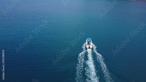 Air flight over the boat in the sea photo