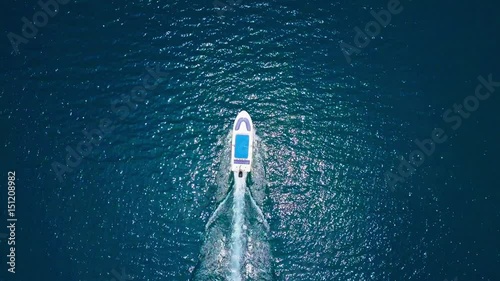 Air flight over the boat in the sea photo