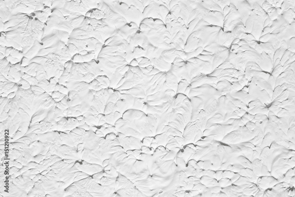 The texture of the paint is white. The plaster with divorces is put on the wall. The texture of the paint is white. The plaster with divorces is put on the wall.