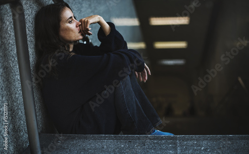 Quadro su tela Adult Woman Sitting Look Worried on The Stairway