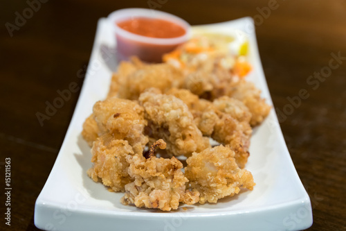 Golden brown deep fried calamari, served with seafood sauce.