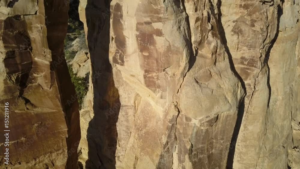Aerial Eagle Arch San Rafael Utah desert close climb. Desert landscape. Sandstone towers, valleys, canyons, gorges, mesas. Off road all terrain 4x4 vehicle ATV. Thrilling dangerous wilderness.