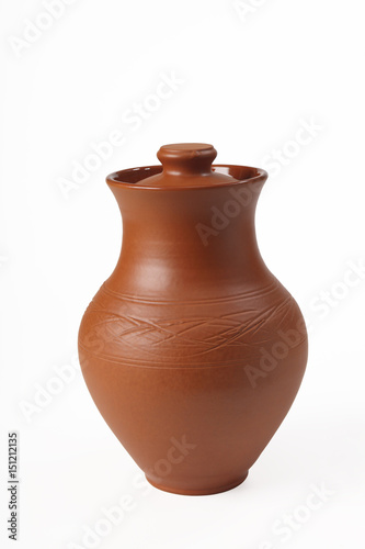 Ceramic (from red clay) jug with a lid on a white background. Isolated. Close-up