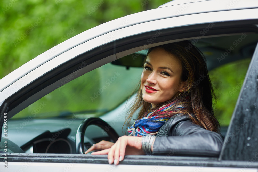 Young woman and her new car