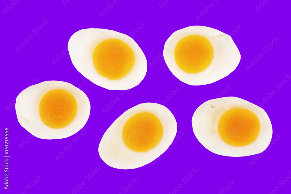 Egg jelly candies isolated on the blue background Egg jelly candies isolated on the blue background