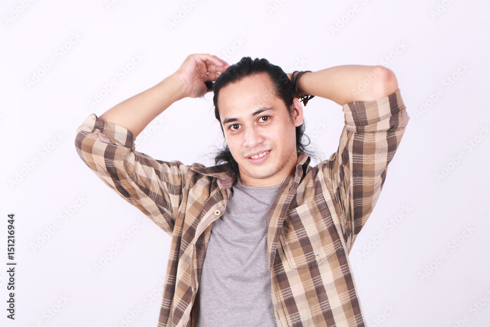 Male Asian Model Tying His Long Hair Male Asian Model Tying His Long Hair