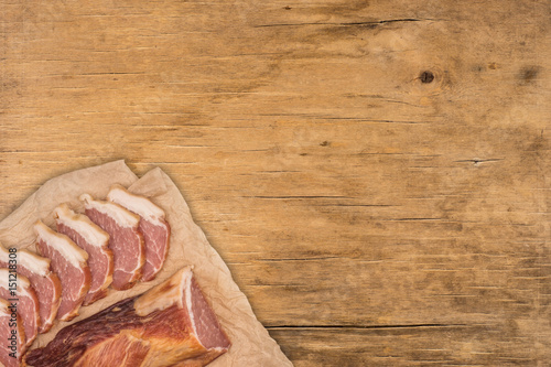 Smoked meat on a wooden table.