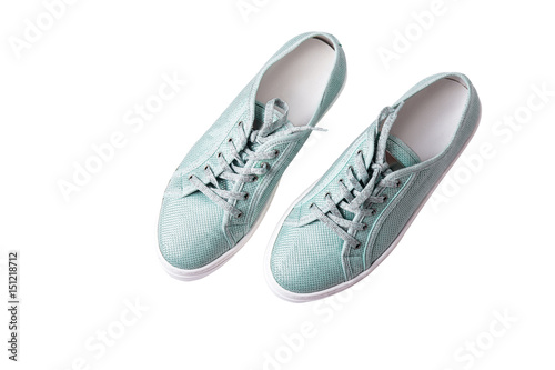 Pair of blue sneakers isolated over white