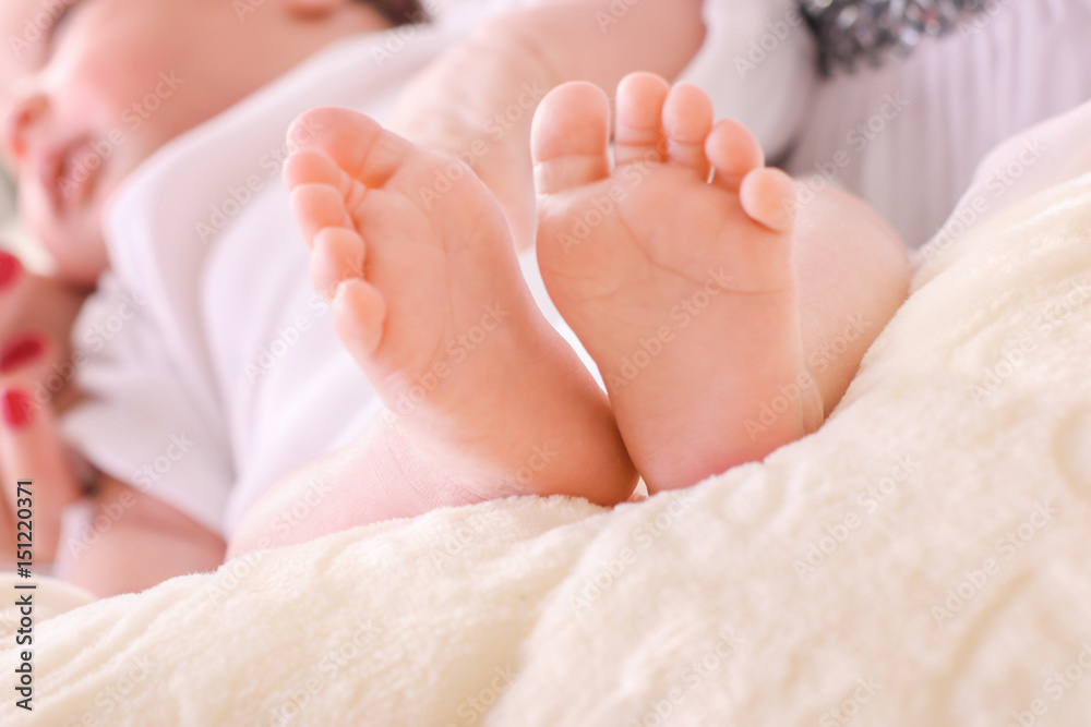 Little baby sleeping sweetly on the bed and his little feet beautiful look together Little baby sleeping sweetly on the bed and his little feet beautiful look together
