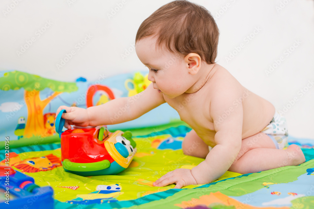 baby playing with educational toys lying baby playing with educational toys lying
