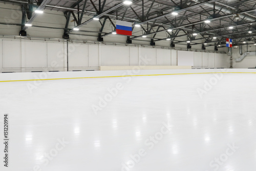 Big empty indoor new ice rick for competitions, hanging flags