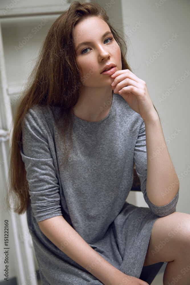 Brunet cheerful young woman. Beauty portrait. Long chic elegant hair. Model tests. Young girl Brunet cheerful young woman. Beauty portrait. Long chic elegant hair. Model tests. Young girl