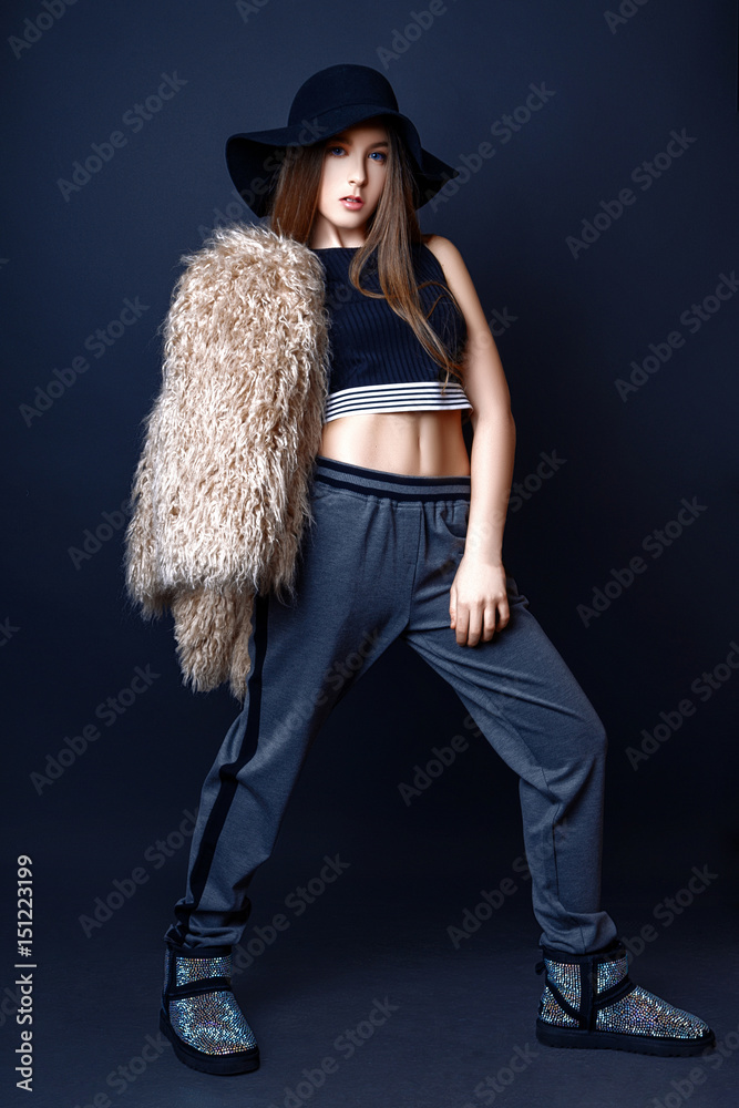 Cute girl teenage with long hair posing studio nature portrait.