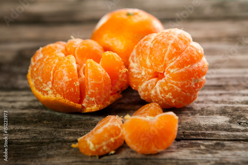 Fresh clementines, tangerines on table