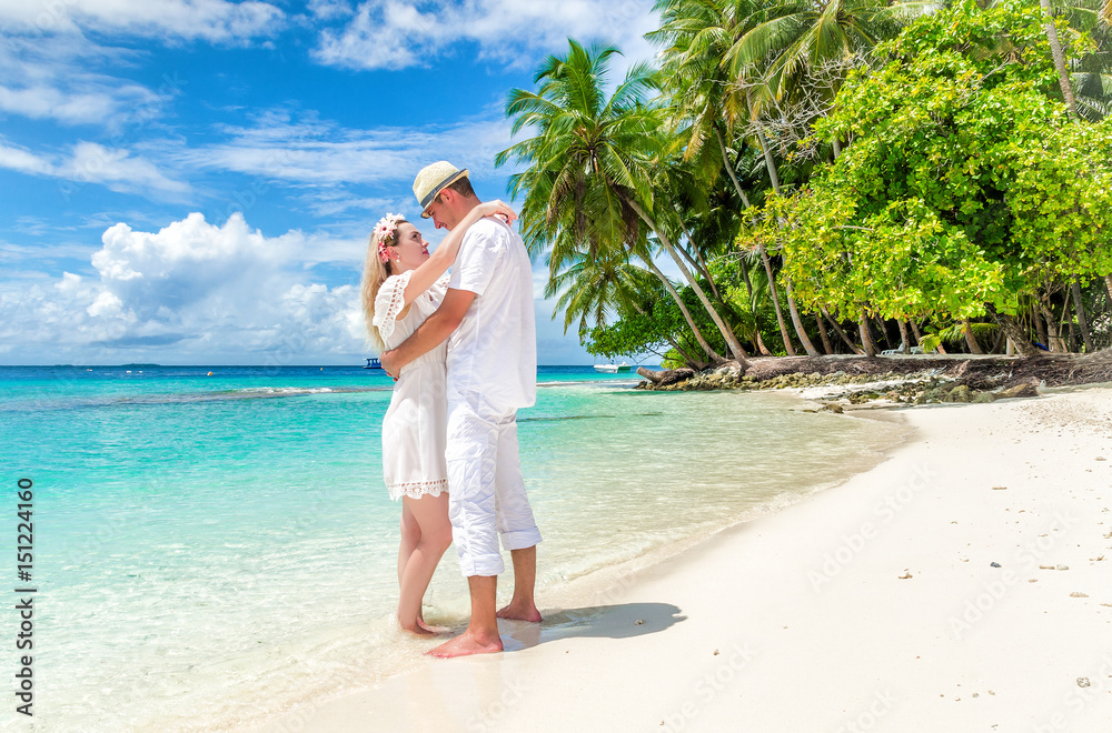 Two lovers stroll around the island. The Maldives. Two lovers stroll around the island. The Maldives.