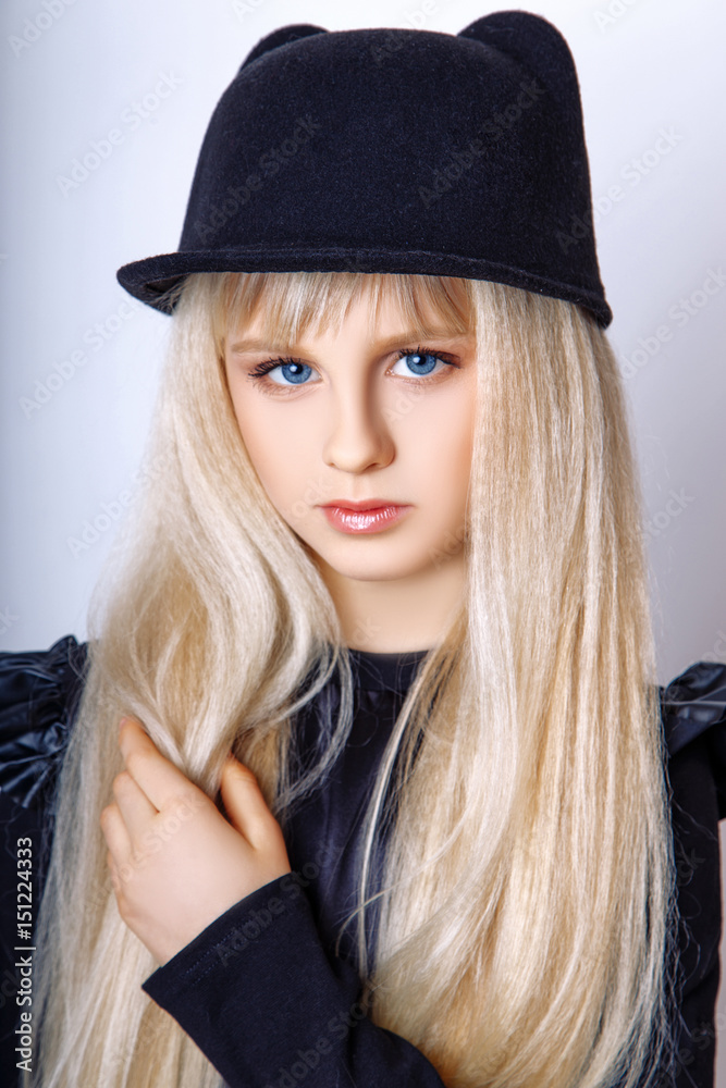 Cute girl teenage with long blond hair posing studio nature portrait. Cute girl teenage with long blond hair posing studio nature portrait.