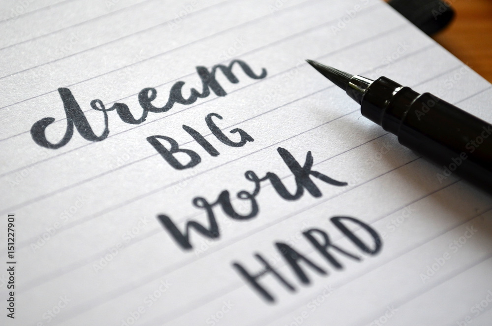 DREAM BIG WORK HARD motivational quote written in notebook DREAM BIG WORK HARD motivational quote written in notebook