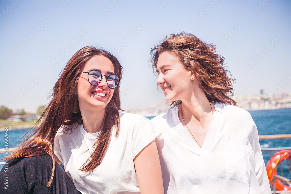 Close up portrait happy women enjoying the sea from ferry, have fun Close up portrait happy women enjoying the sea from ferry, have fun
