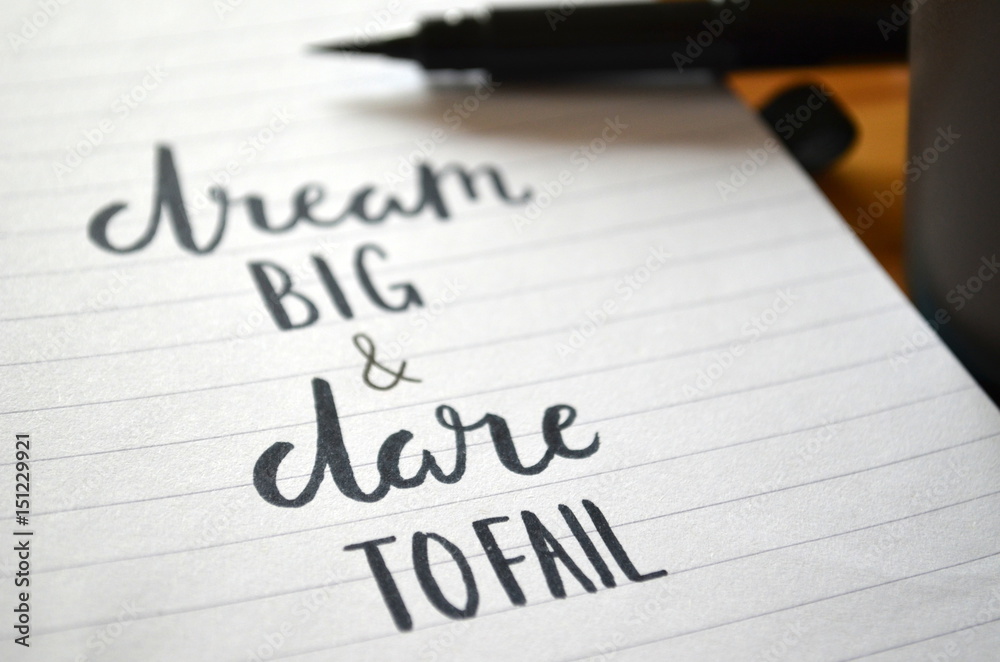 DREAM BIG & DARE TO FAIL motivational quote written in notebook DREAM BIG & DARE TO FAIL motivational quote written in notebook