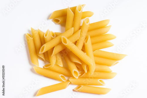 Heap penne pasta isolated on white background.