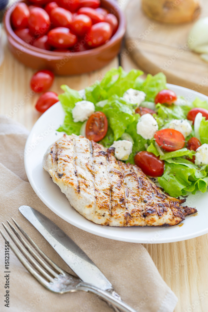 Grilled Chicken Breast with Fresh Vegetables on Light Wooden Background, Selective Focus