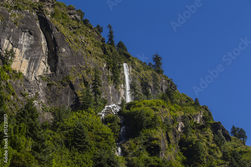 Majestic mountain and waterfall in Himalayas mountains in Nepal
