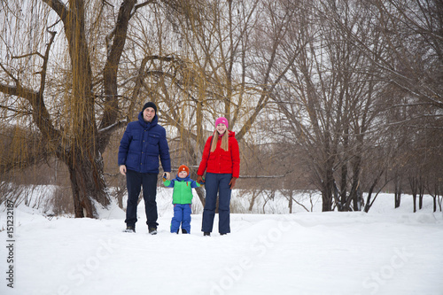 happy young family spending time outdoor in winter