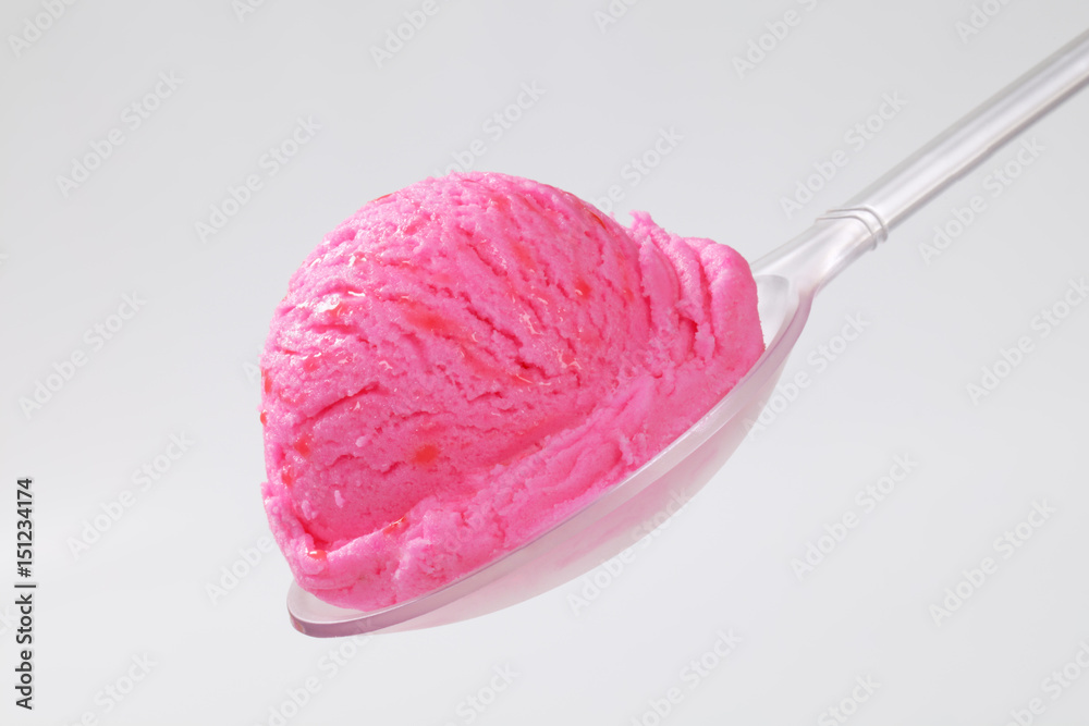 Scoop of pink ice cream on spoon Scoop of pink ice cream on spoon